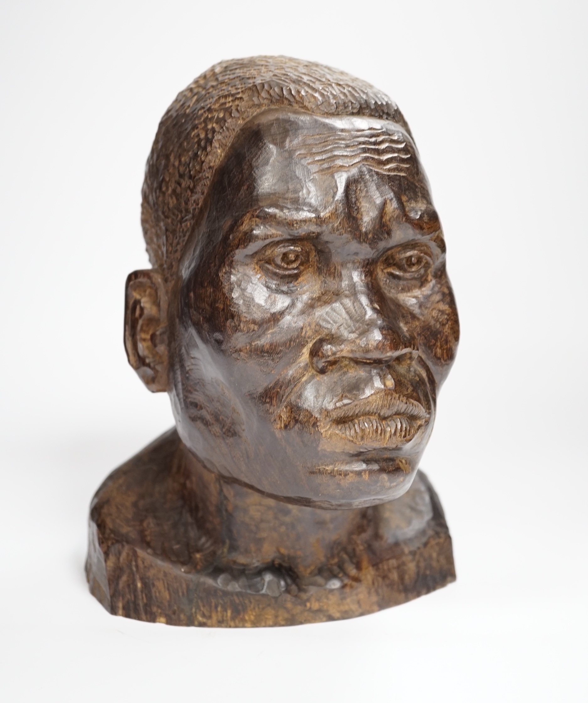 An African carved ebony bust of a gentleman, incised Silas to base, 24cm high